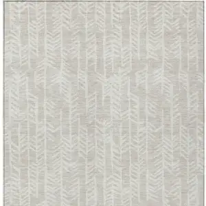 Photo of Beige And Ivory Tribal Washable Indoor Outdoor Area Rug