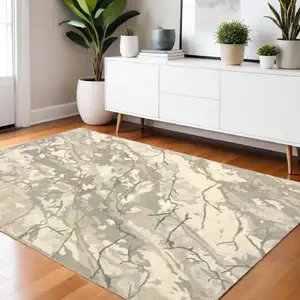 Photo of Beige And Ivory Wool Abstract Hand Tufted Area Rug