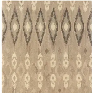 Photo of Beige And Ivory Wool Abstract Hand Tufted Area Rug