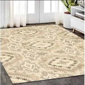 Photo of Beige And Ivory Wool Abstract Hand Tufted Area Rug