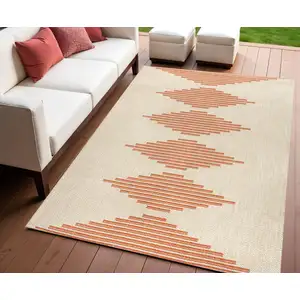 Photo of Beige And Orange Abstract Indoor Outdoor Area Rug