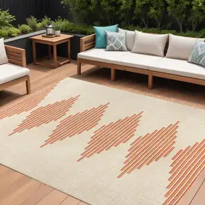 Photo of Beige And Orange Abstract Indoor Outdoor Area Rug