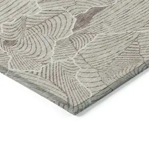 Photo of Beige And Tan Abstract Washable Indoor Outdoor Area Rug