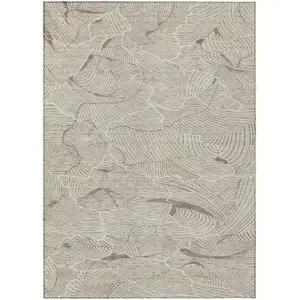 Photo of Beige And Tan Abstract Washable Indoor Outdoor Area Rug