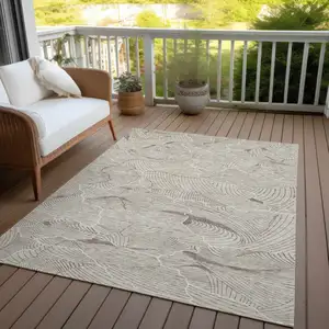 Photo of Beige And Tan Abstract Washable Indoor Outdoor Area Rug