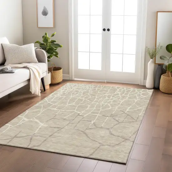 Beige And Tan Abstract Washable Indoor Outdoor Area Rug Photo 9