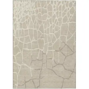 Photo of Beige And Tan Abstract Washable Indoor Outdoor Area Rug