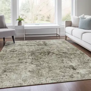 Photo of Beige And Taupe Abstract Washable Area Rug With UV Protection