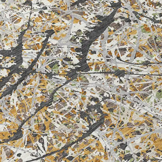 Beige Black And Ivory Abstract Washable Indoor Outdoor Area Rug Photo 1