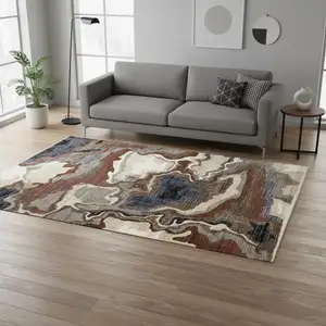 Photo of Beige Blue And Black Abstract Area Rug