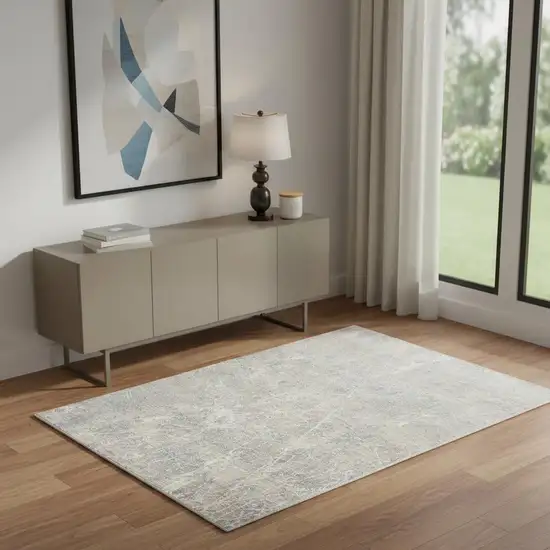 Beige Blue And Brown Abstract Area Rug Photo 1