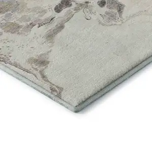 Photo of Beige Blue And Copper Abstract Washable Area Rug With UV Protection