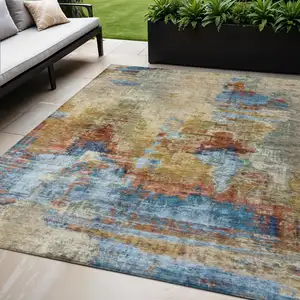 Photo of Beige Blue And Gold Abstract Washable Indoor Outdoor Area Rug