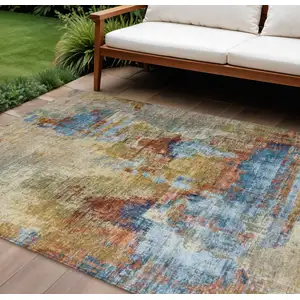 Photo of Beige Blue And Gold Abstract Washable Indoor Outdoor Area Rug
