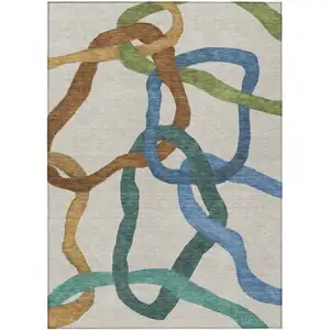 Photo of Beige Blue And Green Abstract Washable Indoor Outdoor Area Rug