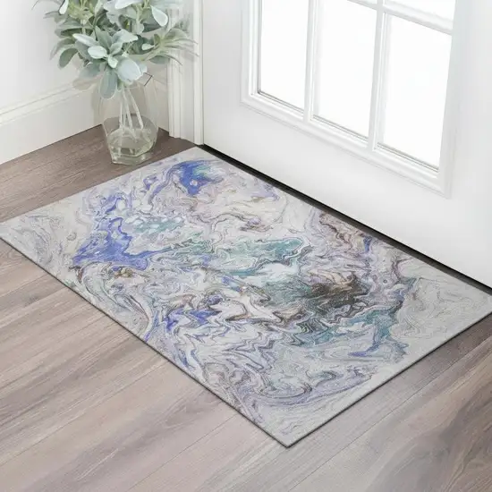 Beige Blue And Ivory Abstract Washable Area Rug With UV Protection Photo 1