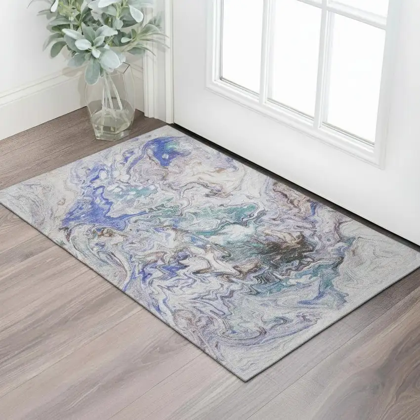 Beige Blue And Ivory Abstract Washable Area Rug With UV Protection Photo 1