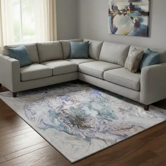 Beige Blue And Ivory Abstract Washable Area Rug With UV Protection Photo 1