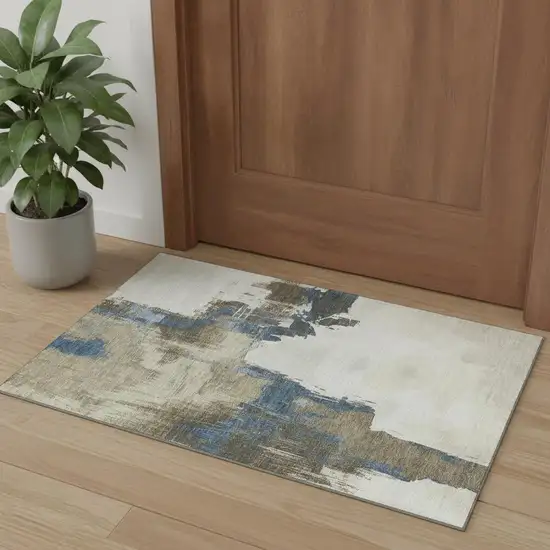 Beige Blue And Ivory Abstract Washable Area Rug With UV Protection Photo 1