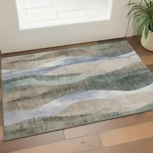 Photo of Beige Blue And Ivory Abstract Washable Area Rug With UV Protection