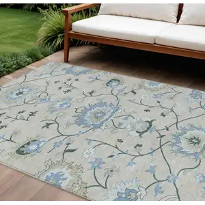 Photo of Beige Blue And Ivory Floral Washable Indoor Outdoor Area Rug