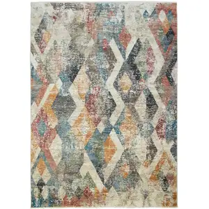 Photo of Beige Blue and Gray Geometric Distressed Area Rug With Fringe
