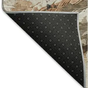 Photo of Beige Brown And Charcoal Animal Print Washable Area Rug With UV Protection