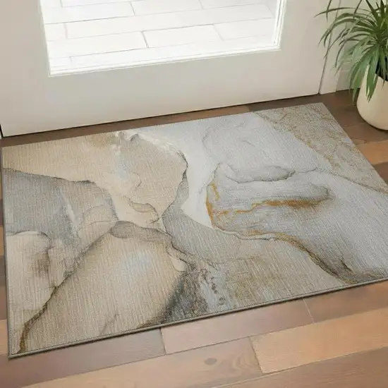 Beige Brown And Ivory Abstract Washable Area Rug With UV Protection Photo 1