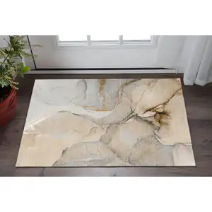 Photo of Beige Brown And Ivory Abstract Washable Area Rug With UV Protection