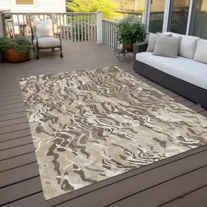 Photo of Beige Brown And Ivory Abstract Washable Indoor Outdoor Area Rug