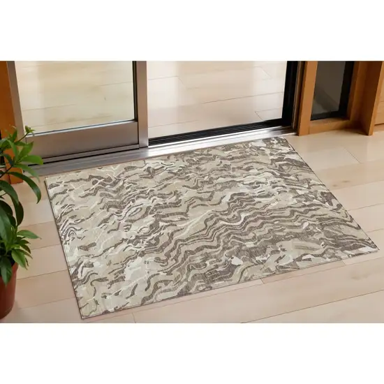 Beige Brown And Ivory Abstract Washable Indoor Outdoor Area Rug Photo 1