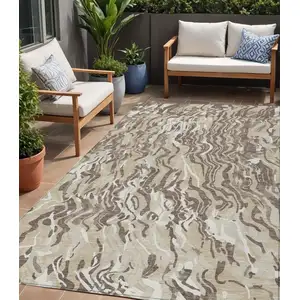 Photo of Beige Brown And Ivory Abstract Washable Indoor Outdoor Area Rug