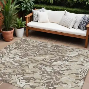 Photo of Beige Brown And Ivory Abstract Washable Indoor Outdoor Area Rug