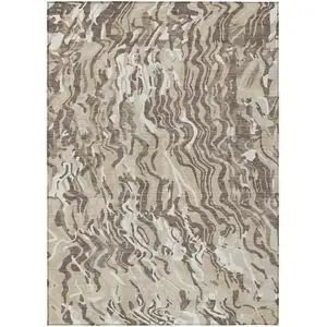 Photo of Beige Brown And Ivory Abstract Washable Indoor Outdoor Area Rug