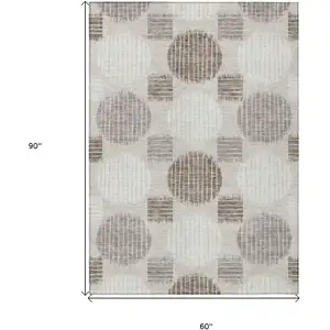Photo of Beige Brown And Ivory Geometric Washable Indoor Outdoor Area Rug