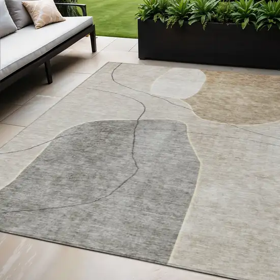 Beige Brown And Taupe Abstract Washable Indoor Outdoor Area Rug Photo 1