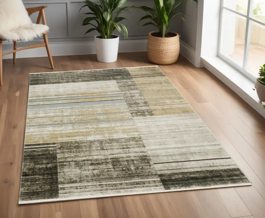 Beige Charcoal Brown Grey Tan Gold And Blue Geometric Power Loom Stain Resistant Area Rug With Fringe Photo 1