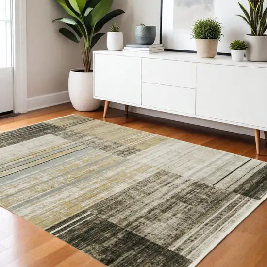 Beige Charcoal Brown Grey Tan Gold And Blue Geometric Power Loom Stain Resistant Area Rug With Fringe Photo 1