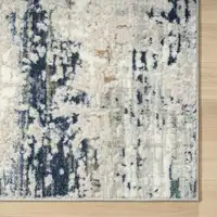 Photo of Beige Cream Blue And Gray Abstract Stain Resistant Area Rug