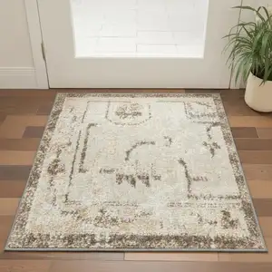 Photo of Beige Floral Distressed Area Rug