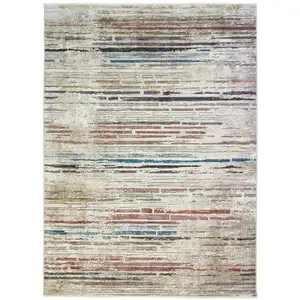 Photo of Beige Geometric Distressed Area Rug With Fringe
