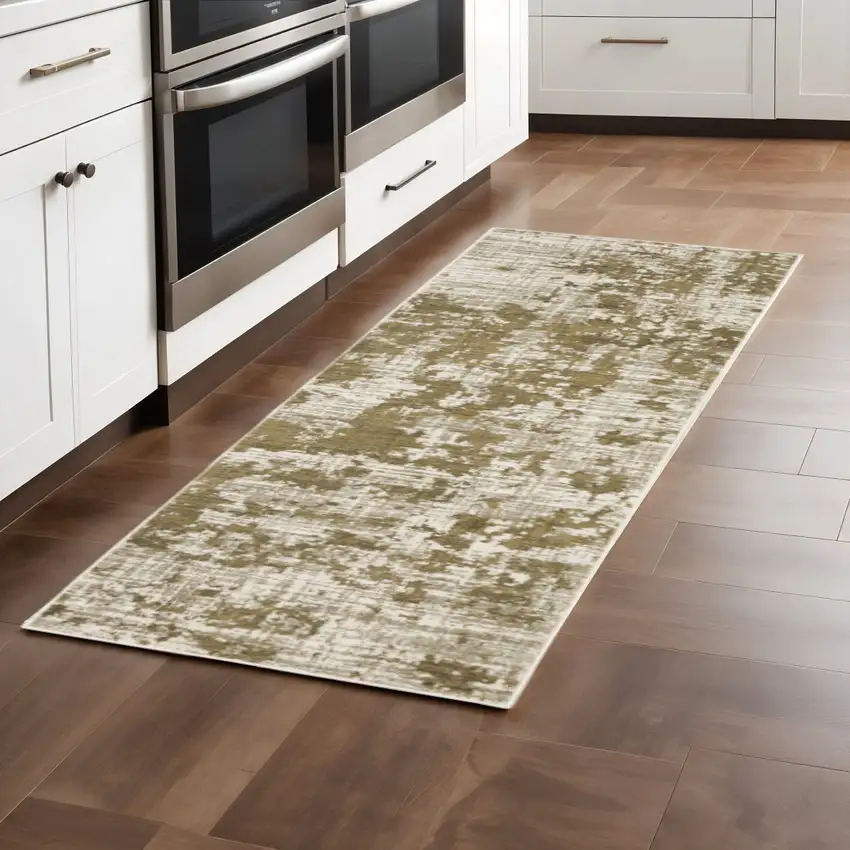 2' X 8' Beige Gold And Grey Abstract Power Loom Stain Resistant Runner Rug Photo 1