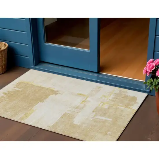 Beige Gold And Tan Abstract Washable Indoor Outdoor Area Rug Photo 1