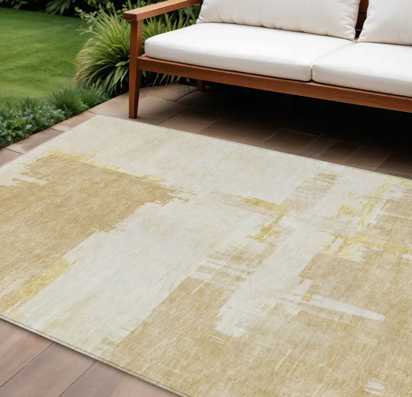Beige Gold And Tan Abstract Washable Indoor Outdoor Area Rug Photo 1