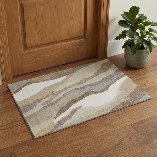 Beige Gold And Taupe Abstract Washable Area Rug With UV Protection Photo 1