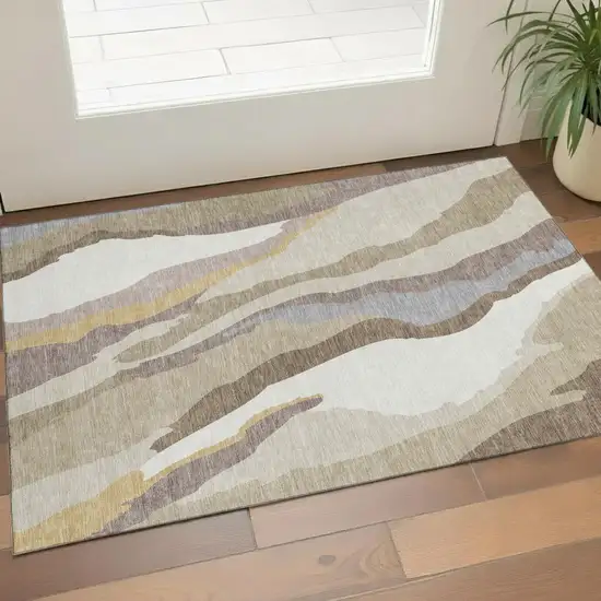 Beige Gold And Taupe Abstract Washable Area Rug With UV Protection Photo 1