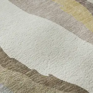 Photo of Beige Gold And Taupe Abstract Washable Area Rug With UV Protection