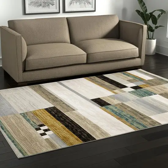 Beige Gold Black Grey Tan Teal and Rust Geometric Power Loom Area Rug Photo 1