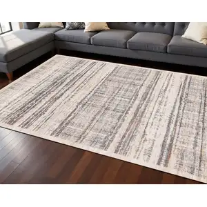 Photo of Beige Gray And Brown Abstract Area Rug