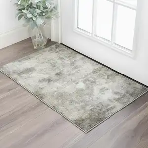 Photo of Beige Gray And Ivory Abstract Washable Area Rug With UV Protection